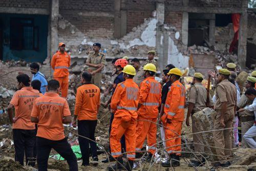 epa13202394 Members of the Indian National Disaster Response Force (NDRF) perform rescue work at a site after an explosion in a firecracker factory in Pipri, Uttar Pradesh state, India, 31 August 2026. The explosion in the  firecracker factory killed more than five people and several injured, according to official sources. The explosion also damaged the...