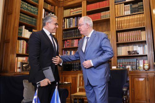 epa13228105 Greek President Konstantinos Tasoulas (R) welcomes UNESCO Director-General Khaled al-Anani (L) during their meeting at the Presidential Mansion in Athens, Greece, 10 September 2026.  EPA/GEORGE VITSARAS