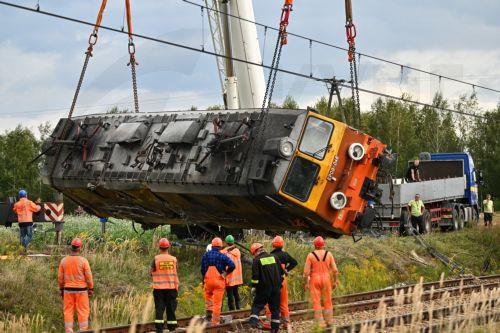 epa13228259 A derailed locomotive is lifted after an accident in Sokolniki Suche, Poland, 10 September 2026. Emergency response teams and technical crews worked to clear the site of a rail accident that occurred on 09 September when a truck collided with a PKP Intercity passenger train traveling on the Lublin–Szczecin route. The impact derailed the...