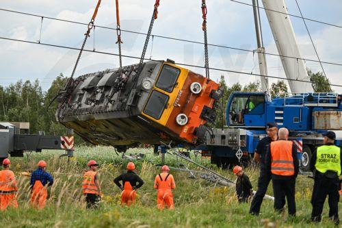 epa13228260 A derailed locomotive is lifted after an accident in Sokolniki Suche, Poland, 10 September 2026. Emergency response teams and technical crews worked to clear the site of a rail accident that occurred on 09 September when a truck collided with a PKP Intercity passenger train traveling on the Lublin–Szczecin route. The impact derailed the...