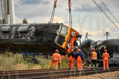 epa13228261 A derailed locomotive is lifted after an accident in Sokolniki Suche, Poland, 10 September 2026. Emergency response teams and technical crews worked to clear the site of a rail accident that occurred on 09 September when a truck collided with a PKP Intercity passenger train traveling on the Lublin–Szczecin route. The impact derailed the...
