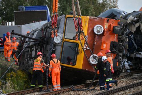 epa13228266 A derailed locomotive is lifted after an accident in Sokolniki Suche, Poland, 10 September 2026. Emergency response teams and technical crews worked to clear the site of a rail accident that occurred on 09 September when a truck collided with a PKP Intercity passenger train traveling on the Lublin–Szczecin route. The impact derailed the...