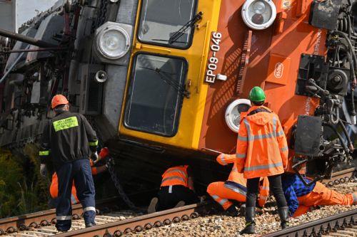 epa13228267 A derailed locomotive is lifted after an accident in Sokolniki Suche, Poland, 10 September 2026. Emergency response teams and technical crews worked to clear the site of a rail accident that occurred on 09 September when a truck collided with a PKP Intercity passenger train traveling on the Lublin–Szczecin route. The impact derailed the...