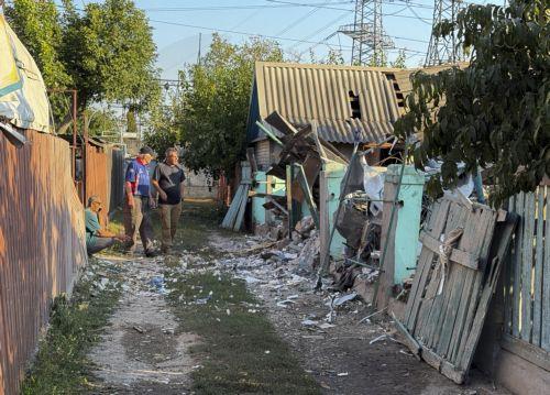 epa13233524 People inspect the damage at the site of a Russian strike on a building in Zaporizhzhia, Ukraine, 12 September 2026, amid the ongoing Russian invasion. At least two people were killed and four others injured in the Russian attack on Zaporizhzhia, according to the Ukrainian State Emergency Service (SES).  EPA/DARYNA NAUMOVA
