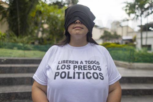 epa13238098 Andreina Baduel, director of the NGO Committee for the Freedom of Political Prisoners (CLIPP), is blindfolded while participating in a vigil to pray for the release of political prisoners in Caracas, Venezuela, 13 September 2026. Baduel believes that the Venezuelan government lacks the will to release political prisoners, who number more than...