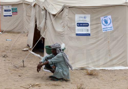 epa13246547 A displaced man sits next to a shelter at a makeshift camp for Internally Displaced Persons (IDPs) in the southern port city of Aden, Yemen, 17 September 2026. At least 125,000 Yemenis have been displaced over the past two weeks amid the country’s renewed fighting between Houthi forces and Saudi-backed government forces, according to the UN...