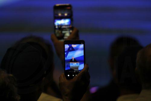 epa13246649 People use their phones to record Israeli Prime Minister Benjamin Netanyahu during a Likud party elections campaign event in Tel Aviv, Israel, 17 September 2026. General elections are scheduled to be held in Israel on 27 October 2026.  EPA/ATEF SAFADI
