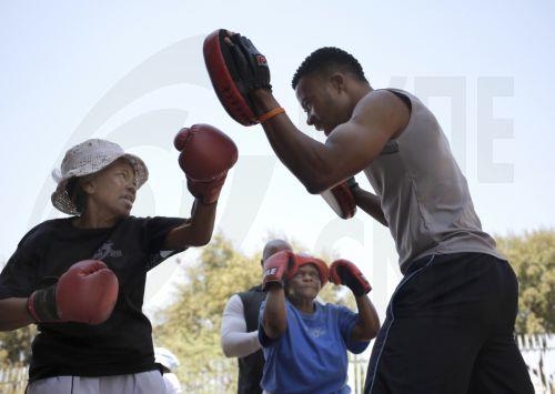 epa13273979 (FILE) -Two grannies punch their coaches bags during their twice weekly boxing traning session run by the 'A Team' gym in Cosmo City, Johannesburg, South Africa, 14 September 2017 (reissued on 01 October 2026). 01 October marks the United Nations International Day of Older Persons. This year, the theme is ‘The Age of Longevity: Rethinking...