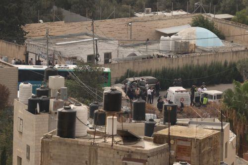 epa13274108 Israeli settlers gather near vehicles at Joseph's Tomb in the eastern part of Nablus, West Bank, early 01 October 2026. According to the Palestinian news agency Wafa, Israeli military vehicles entered the eastern part of the city, forced residents to evacuate homes surrounding the site and used the houses as military posts.  EPA/ALAA BADARNEH