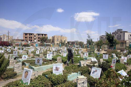 epa13277430 A Houthi soldier walks amongst portraits on the graves of slain Houthi fighters at a cemetery dedicated to those who were killed in Yemen's prolonged conflict, in Sana'a, Yemen, 02 October 2026. Yemen has been at risk of rupture again amid escalating fighting along the country’s Red Sea coastal areas near the Bab al-Mandeb Strait between...