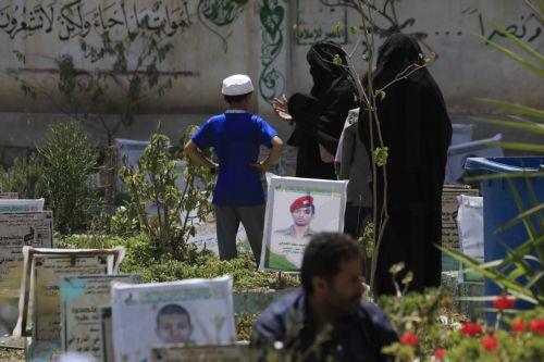 epa13277432 Members of a family visit the grave of a relative at a cemetery dedicated to those who were killed in Yemen's prolonged conflict, in Sana'a, Yemen, 02 October 2026. Yemen has been at risk of rupture again amid escalating fighting along the country’s Red Sea coastal areas near the Bab al-Mandeb Strait between Saudi-backed government forces and...