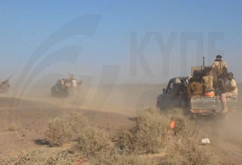 epa13286168 A handout photo made available by the Southern Giants Brigades media office shows pro-government fighters riding trucks during an offensive against Houthi positions in a coastal area of Taiz province, near the Bab al-Mandeb Strait, Yemen, 06 October 2026. The Saudi-backed Yemeni government launched an offensive to retake areas under Houthi...