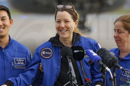 epa13293352 European Space Agency (ESA) astronaut Sophie Adenot (C) of France talks to the media upon arrival at the military section of Cologne Bonn Airport, Germany, 10 October 2026. After 237 days in space, French astronaut Sophie Adenot of the European Space Agency (ESA) returned safely to Earth aboard a SpaceX Dragon capsule, which splashed down in the...