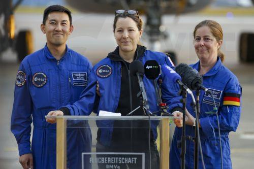epa13293354 European Space Agency (ESA) astronaut Sophie Adenot (C) of France talks to the media upon arrival at the military section of Cologne Bonn Airport, Germany, 10 October 2026. After 237 days in space, French astronaut Sophie Adenot of the European Space Agency (ESA) returned safely to Earth aboard a SpaceX Dragon capsule, which splashed down in the...