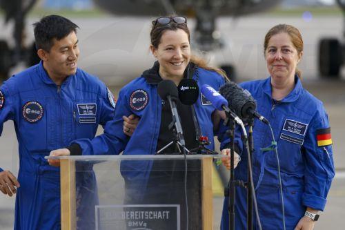 epa13293358 European Space Agency (ESA) astronaut Sophie Adenot (C) of France talks to the media upon arrival at the military section of Cologne Bonn Airport, Germany, 10 October 2026. After 237 days in space, French astronaut Sophie Adenot of the European Space Agency (ESA) returned safely to Earth aboard a SpaceX Dragon capsule, which splashed down in the...