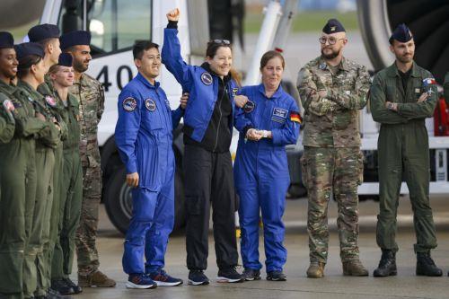 epa13293362 European Space Agency (ESA) astronaut Sophie Adenot (C) of France poses for a group photo after disembarking from a plane upon arrival at the military section of Cologne Bonn Airport, Germany, 10 October 2026. After 237 days in space, French astronaut Sophie Adenot of the European Space Agency (ESA) returned safely to Earth aboard a SpaceX...