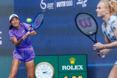 epa13293443 Zhang Shuai of China in action against Erin Routliffe of New Zealand and Aldila Sutjiadi of Indonesia during her Women’s Doubles match at the China Open tennis tournament in Beijing, China, 10 October 2026. China Open runs from 28 September through 11 October.  EPA/WU HAO