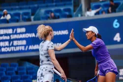 epa13293450 Katerina Siniakova (L) of the Czech Republic and Zhang Shuai (R) of China shake hands during their Women’s Doubles match against Erin Routliffe of New Zealand and Aldila Sutjiadi of Indonesia at the China Open tennis tournament in Beijing, China, 10 October 2026. China Open runs from 28 September through 11 October.  EPA/WU HAO