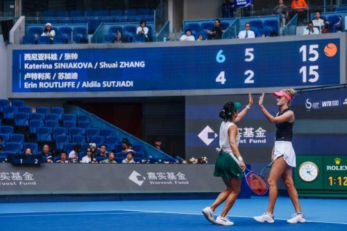 epa13293438 Erin Routliffe (R) of New Zealand and Aldila Sutjiadi (L) of Indonesia shake hands during their Women’s Doubles match against Katerina Siniakova of the Czech Republic and Zhang Shuai of China at the China Open tennis tournament in Beijing, China, 10 October 2026. China Open runs from 28 September through 11 October.  EPA/WU HAO