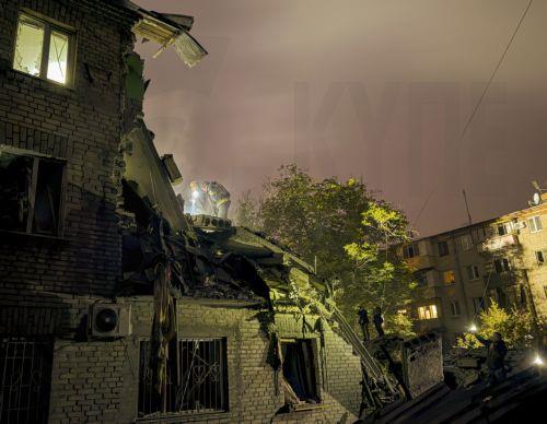 epa13293549 Ukrainian rescuers work at the site of a Russian attack on a residential area in Zaporizhzhia, Ukraine, 10 October 2026, amid the ongoing Russian invasion. At least five people, including two children, were killed and 11 others injured in overnight Russian strikes on the residential area, according to the State Emergency Service.  EPA/DARYNA...