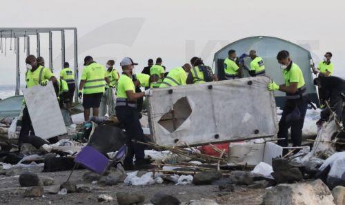 epa13295935 Workers of the 'Makerel' cleaning company remove waste and debris during the eviction of migrants from a migrant camp set up in the esplanade in front of the old El Guano factory in Ceuta, Spain, 11 October 2026. Police carried out the new operation just over 48 hours before an official visit by the Spanish royal couple to the Spanish enclave in...