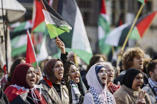 epa13296359 Demonstrators participate in a national protest in support of the Palestinian people on Dam Square in Amsterdam, the Netherlands, marking the conclusion of a nationwide week of action calling for sanctions against Israel, 11 October 2026. According to various activist groups, despite the 'ceasefire', the genocide against the Palestinian people...