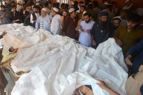 epa13306057 Parents gather beside the bodies of children killed in the collapse of a private school roof at Lady Reading Hospital in Peshawar, Khyber Pakhtunkhwa province, Pakistan, 15 October 2026. At least 17 children were killed and 20 others injured in the collapse, according to officials. Lady Reading Hospital confirmed that 17 bodies had been brought...