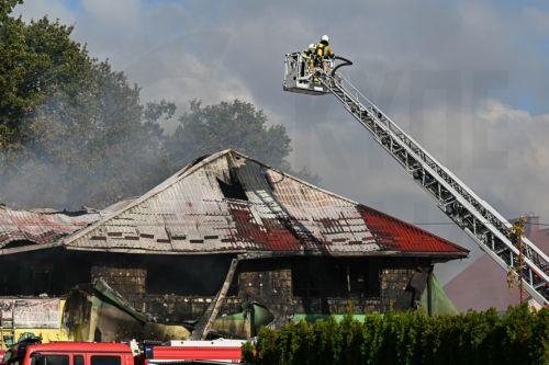 epa13309159 Firefighters fight the flames of a warehouse storing agricultural tractors in Nisko, southeastern Poland, 16 October 2026. Two firefighters were killed while fighting a fire at a warehouse storing agricultural tractor parts in Nisko. The fire broke out at around 8am, and efforts to bring it under control are still ongoing.  EPA/Darek Delmanowicz...