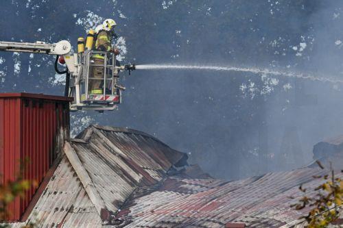 epa13309161 Firefighters fight the flames of a warehouse storing agricultural tractors in Nisko, southeastern Poland, 16 October 2026. Two firefighters were killed while fighting a fire at a warehouse storing agricultural tractor parts in Nisko. The fire broke out at around 8am, and efforts to bring it under control are still ongoing.  EPA/Darek Delmanowicz...