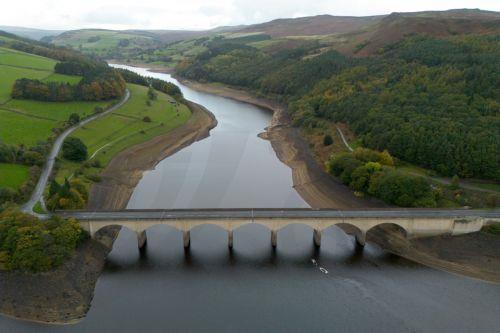 epa13309389 An aerial photograph taken with a drone of the Ladybower Reservoir which is at around 33 percent capacity, in Bamford, Britain, 16 October 2026. Most of England remains in drought as reservoir levels remain critically low after Britain experienced its hottest summer on record. A severe drought has been declared in six areas including Cornwall,...