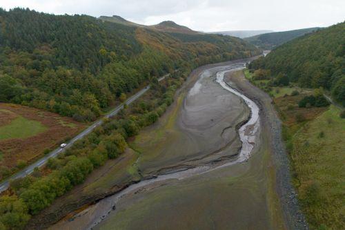 epa13309390 An aerial photograph taken with a drone of the Ladybower Reservoir which is at around 33 percent capacity, in Bamford, Britain, 16 October 2026. Most of England remains in drought as reservoir levels remain critically low after Britain experienced its hottest summer on record. A severe drought has been declared in six areas including Cornwall,...