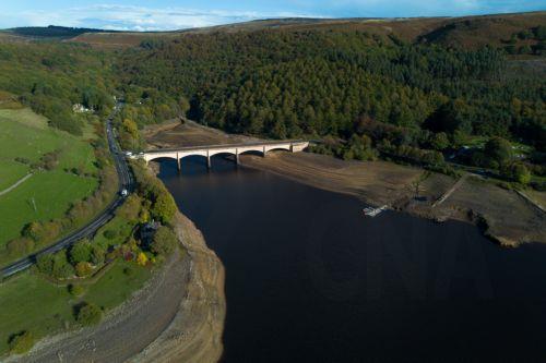 epa13309431 An aerial photograph taken with a drone of the Ladybower Reservoir which is at around 33 percent capacity, in Bamford, Britain, 16 October 2026. Most of England remains in drought as reservoir levels remain critically low after Britain experienced its hottest summer on record. A severe drought has been declared in six areas including Cornwall,...