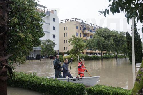 epa13315373 Emergency services navigate a flooded area following Storm Adam's passage through Guardamar de la Safor, Valencia, Spain,19 October 2026. Adam Storm has already claimed two lives and is causing 'extraordinary' rainfall and severe flooding in Valencia and Alicante, with rainfall totals exceeding 600 litres per square metre, rivers bursting their...