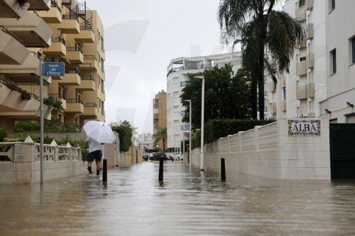 epa13315375 Streets flooded following the passage of Storm Adam in Guardamar de la Safor, Valencia, Spain,19 October 2026. Adam Storm has already claimed two lives and is causing 'extraordinary' rainfall and severe flooding in Valencia and Alicante, with rainfall totals exceeding 600 litres per square metre, rivers bursting their banks and people trapped on...