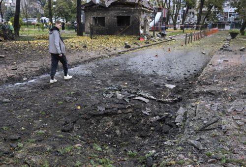 epa13315400 A person walks past the site of a Russian missile strike on a shopping mall in Kyiv, Ukraine, 19 October 2026, amid the ongoing Russian invasion. At least one person was killed, and 10 others were injured in strikes across the region, including three children, according to the State Emergency Service.  EPA/MAXYM MARUSENKO