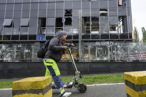 epa13315401 A person walks past the site of a Russian missile strike on a shopping mall in Kyiv, Ukraine, 19 October 2026, amid the ongoing Russian invasion. At least one person was killed, and 10 others were injured in strikes across the region, including three children, according to the State Emergency Service.  EPA/MAXYM MARUSENKO