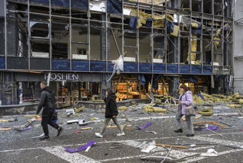 epa13315403 People inspect the site of a Russian missile strike on a shopping mall in Kyiv, Ukraine, 19 October 2026, amid the ongoing Russian invasion. At least one person was killed, and 10 others were injured in strikes across the region, including three children, according to the State Emergency Service.  EPA/MAXYM MARUSENKO