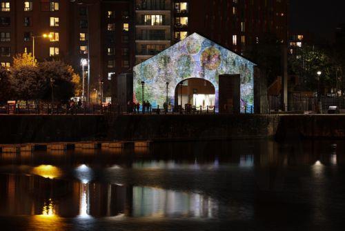 epa13323683 'Together’ by artists Murugiah, Sam Wiehl and Glomoth on display during 'River of Light,' an illuminated outdoor art trail in Liverpool, Britain, 22 October 2026. The exhibition trail features 13 large-scale light installations based on the theme ’Together', with installations focusing on how light can bring people closer together. The...