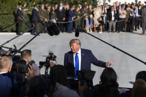 epa13324015 US President Donald Trump (C) speaks to reporters as he departs the White House for a campaign rally in Iowa, in Washington, DC, USA, 22 October 2026. Trump discussed Starlink's operations in Ukraine as well as a campaign ad from Ohio Republican gubernatorial candidate Vivek Ramaswamy that features Democratic opponent Amy Acton’s estranged...