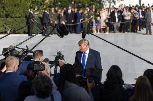 epa13324025 US President Donald Trump (C) speaks to reporters as he departs the White House for a campaign rally in Iowa, in Washington, DC, USA, 22 October 2026. Trump discussed Starlink's operations in Ukraine as well as a campaign ad from Ohio Republican gubernatorial candidate Vivek Ramaswamy that features Democratic opponent Amy Acton’s estranged...