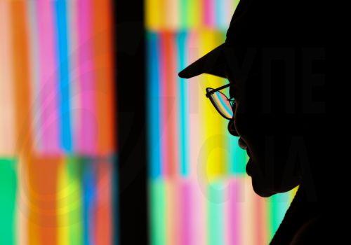epaselect epa13323658 A person is silhouetted in front of 'Colour Rush’ by British artist Liz West during 'River of Light,' an illuminated outdoor art trail in Liverpool, Britain, 22 October 2026. The exhibition trail features 13 large-scale light installations based on the theme ’Together', with installations focusing on how light can bring people closer...