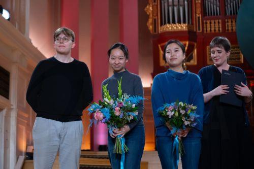 epa13324229 (L-R) Winner Ukrainian violinist Bohdan Luts, second-placed Chinese violinist Jinzhu Li, third-placed South Korean violinist SooBeen Lee and Competition Director Karolina Kazmierczak pose for a photo after the final of the 17th International Henryk Wieniawski Violin Competition at the Adam Mickiewicz University in Poznan, Poland, 22 October...