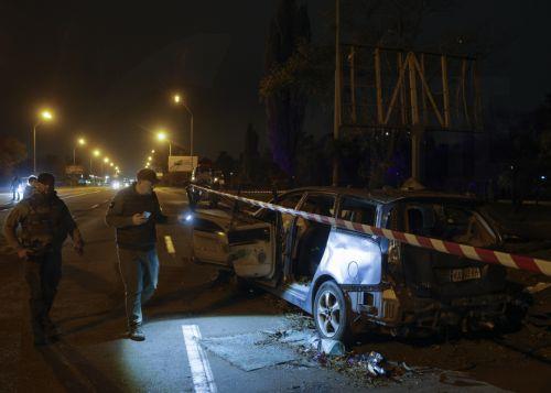 epa13333639 Ukrainian officials inspect a damaged car at the site of a Russian missile strike on a road in a residential area in Kyiv, Ukraine, 27 October 2026, amid the ongoing Russian invasion. At least one person died, and 10 others were injured during the overnight Russian ballistic missile attack, according to the State Emergency Service report. ...