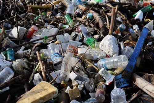 epa13333725 A pile of plastic and wooden waste covers a riverbank in Banda Aceh, Indonesia, 27 October 2026. Plastic waste washed down from residential areas via local rivers accumulates along coastal banks before flowing into the sea.  EPA/HOTLI SIMANJUNTAK