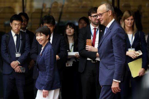 epa13336348 German Chancellor Friedrich Merz (R) and Japanese Prime Minister Sanae Takaichi (L) arrive for a meeting with business representatives at the prime minister's official residence in Tokyo, Japan, 28 October 2026. Merz, accompanied by a business delegation, is currently on a trip to Singapore, Japan and South Korea until 30 October.  EPA/KIYOSHI...
