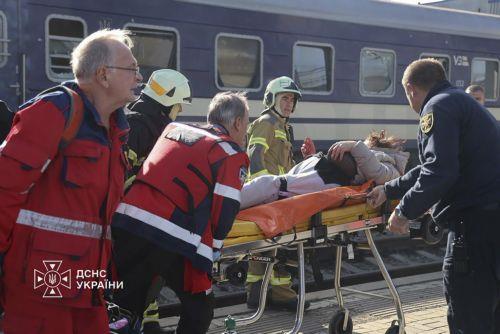 epa13339252 A handout photo released by the press service of the State Emergency Service (SES) of Ukraine shows Ukrainian rescuers evacuating an injured person at the site of a Russian drone strike on a platform at the railway station in Dnipro, central Ukraine, 29 October 2026, amid the Russian invasion. At least 14 people were killed and 14 others injured...