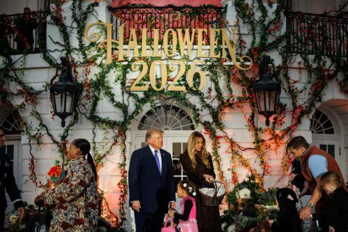 epa13340273 US President Donald Trump and First Lady Melania Trump hand out candy to children in costume during a Halloween event on the South Lawn of the White House in Washington, DC, USA, 29 October 2026. The President and First Lady welcomed military, law enforcement, administration officials and their children to the annual trick-or-treat celebration...