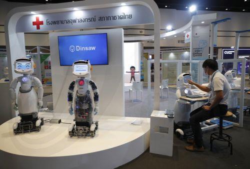 epa10207093 A Thai exhibitor set up Thai-developed Dinsaw smart robot nurses at the Sustainability Expo 2022 in Bangkok, Thailand, 26 September 2022. The Sustainability Expo 2022 is being hosted to support the country's target of sustainable development goals by 2030, with hundreds of international and domestic companies exhibiting their sustainable...