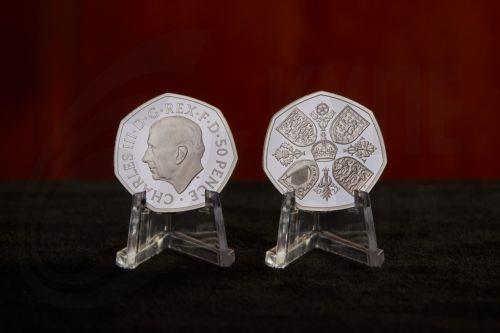 epa10214858 A handout photo made available by the British Royal Mint, London, Britain 30 September 2022 unveiling the official coin effigy of His Majesty King Charles III. The first coins to bear The Kingâ€™s portrait are a special Â£5 Crown and 50 pence (shown) commemorating the life and legacy of Her Late Majesty Queen Elizabeth II.  EPA/TOM HARRISON...