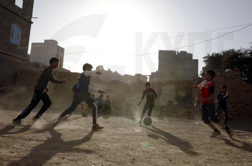 epa10315093 Yemeni children play soccer in a field on the eve of World Children's Day, in Sana'a, Yemen, 19 November 2022. World Children's Day is observed annually on 20 November to highlight children in demanding action to protect and promote child rights as well as improving children's welfare. It also marks the Declaration of the Rights of the Child by...